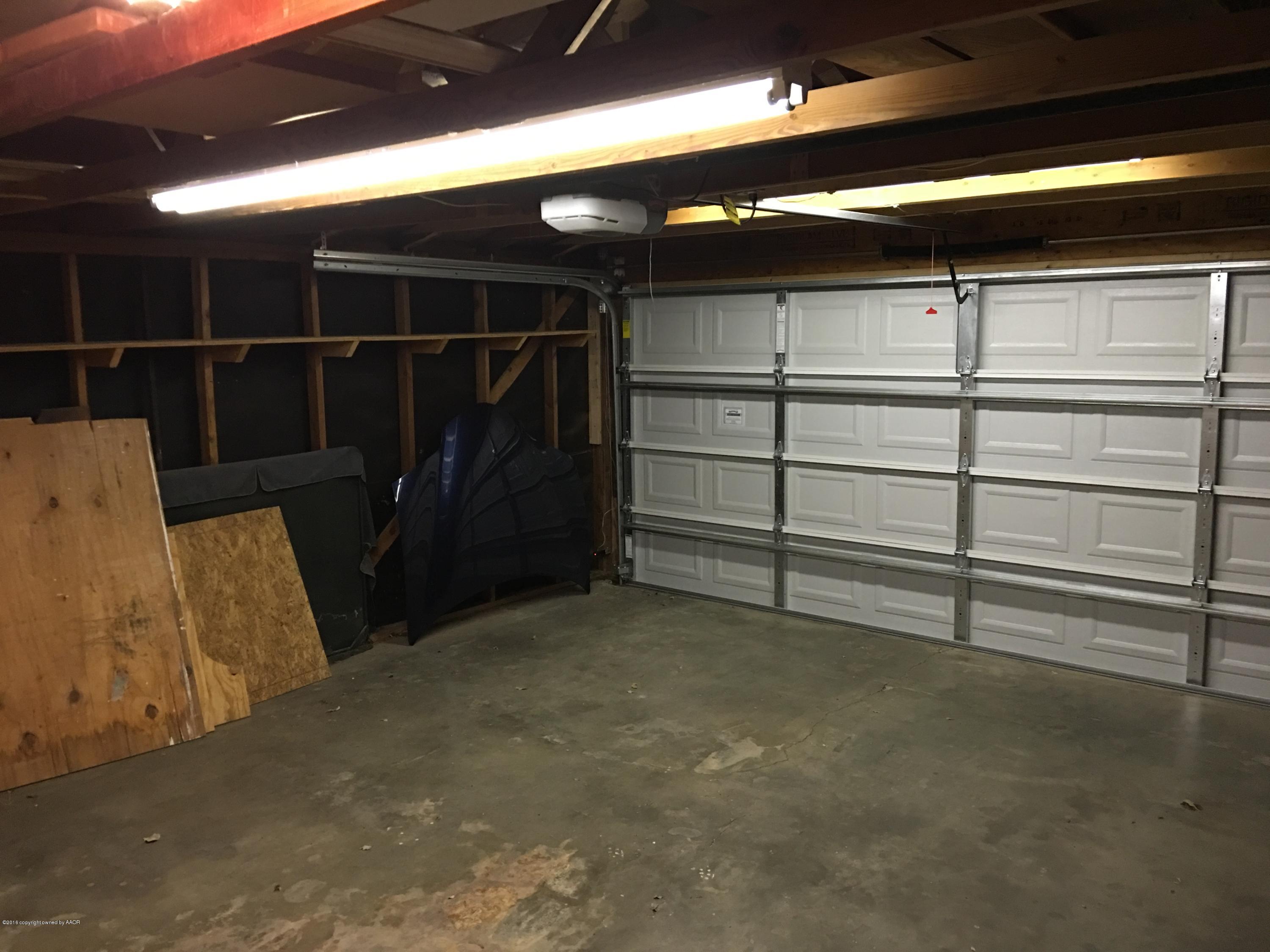 4321 South Travis Street Amarillo, TX 79110 - Photo 26 of 38 a view of a room with racks on the wall