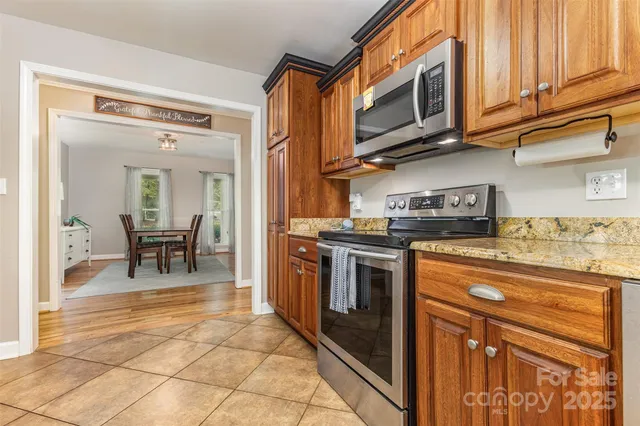 a view of a room that has a table and a chair