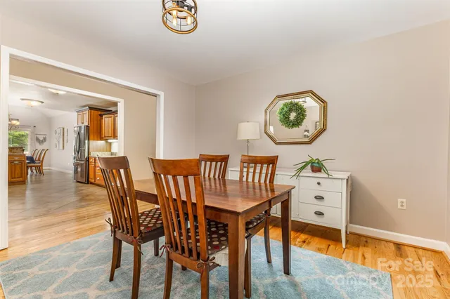 a bedroom with furniture and a flat screen tv