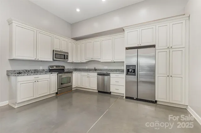 a yellow house with a yard