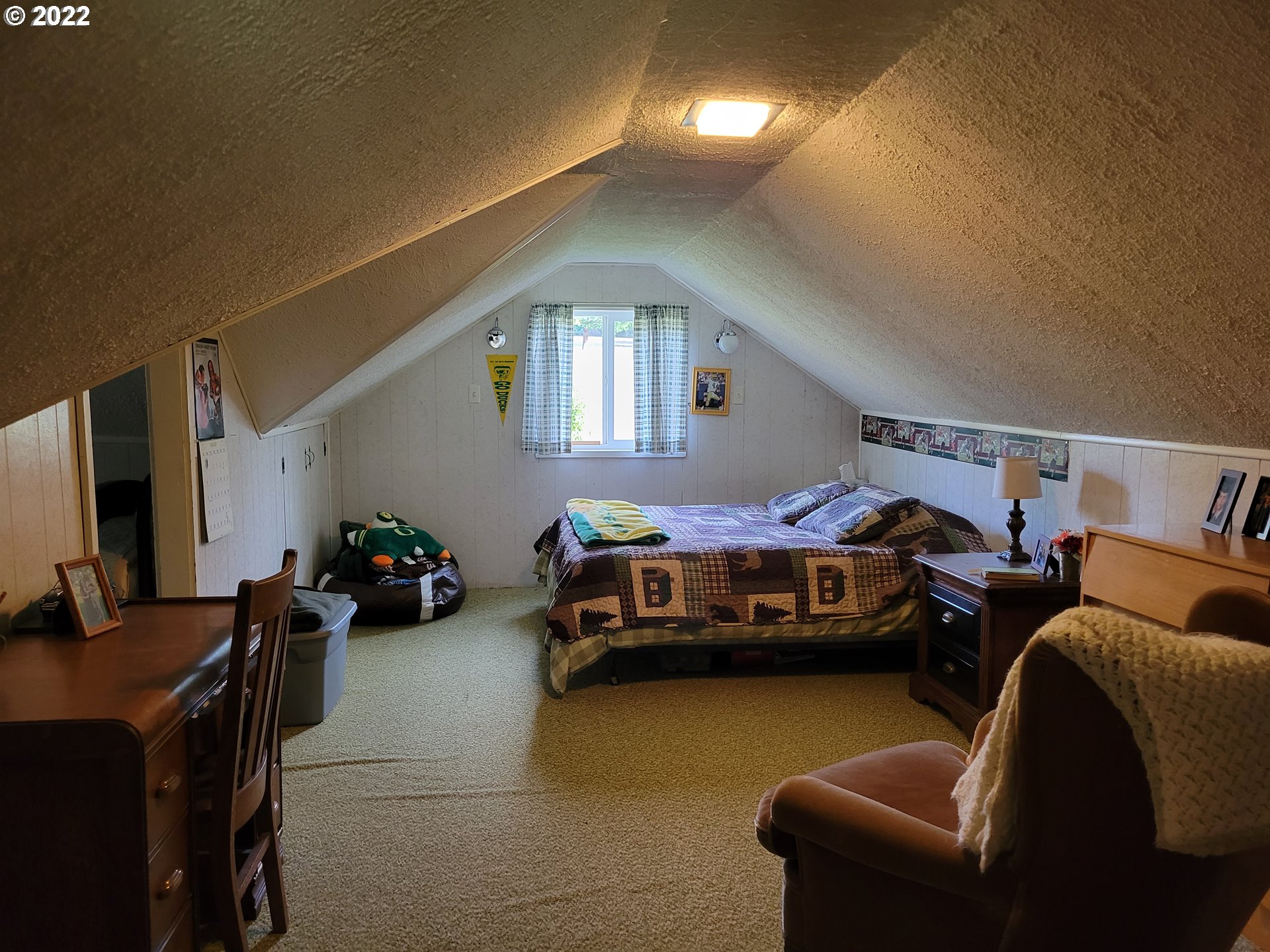 5064 Henderer Road Elkton, OR 97436 - Photo 13 of 32 a bedroom with furniture and a window