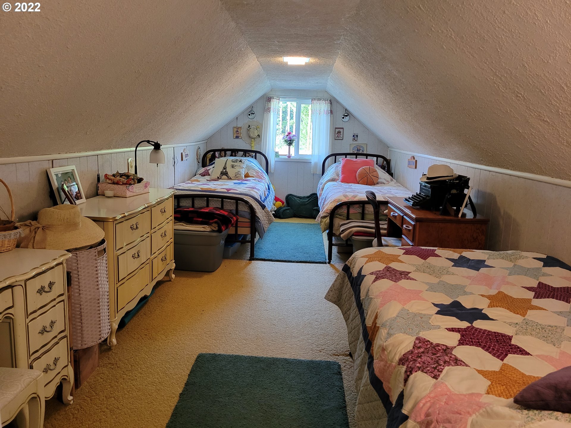5064 Henderer Road Elkton, OR 97436 - Photo 14 of 32 a bedroom with two beds and a lamp