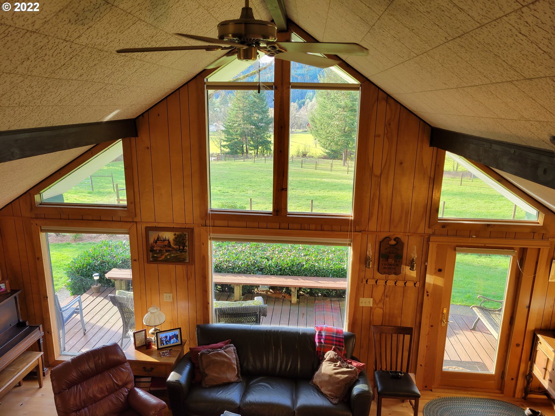5064 Henderer Road Elkton, OR 97436 - Photo 15 of 32 a living room with furniture and a window