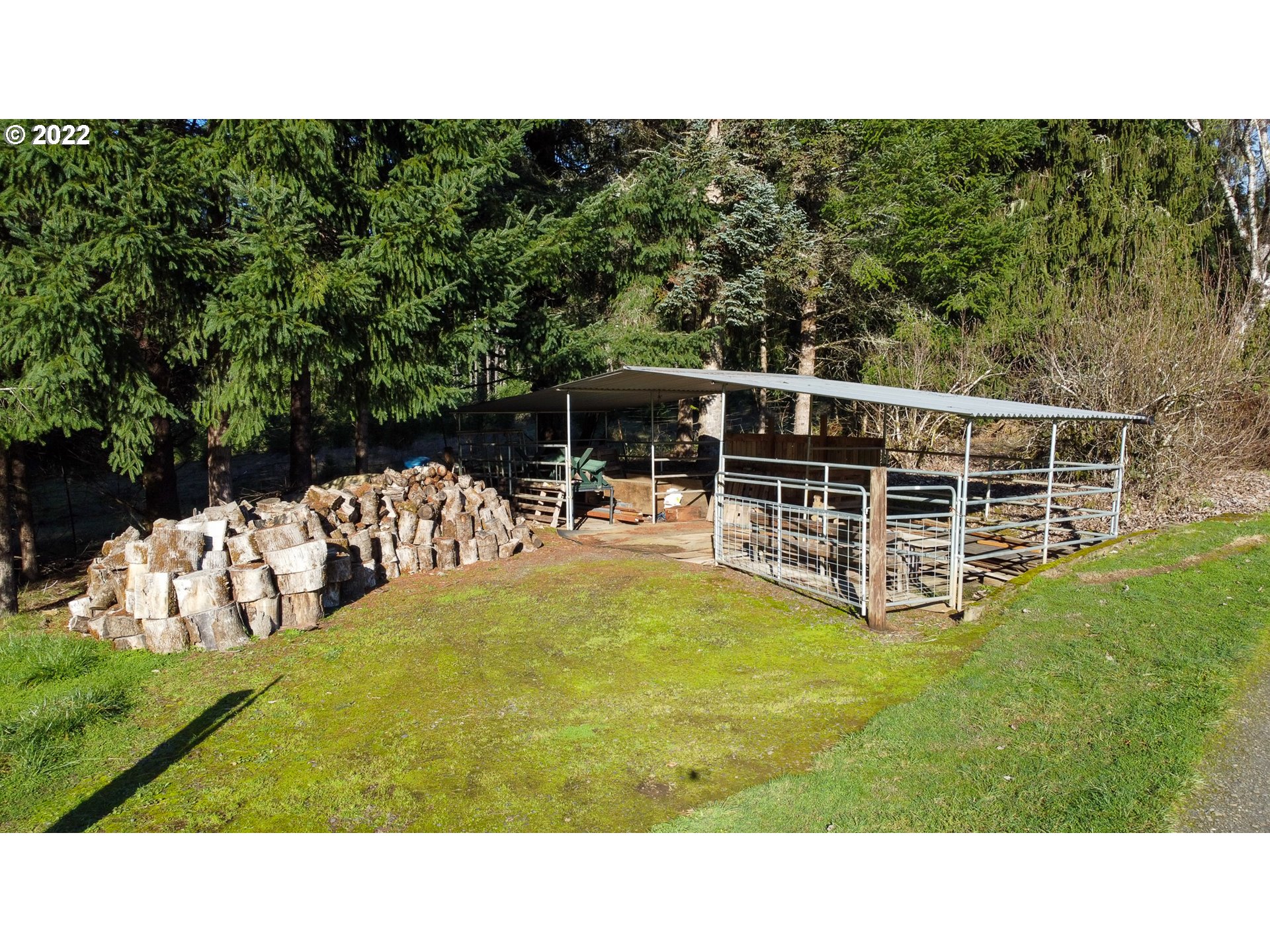 5064 Henderer Road Elkton, OR 97436 - Photo 21 of 32 a view of a swimming pool with lawn chairs