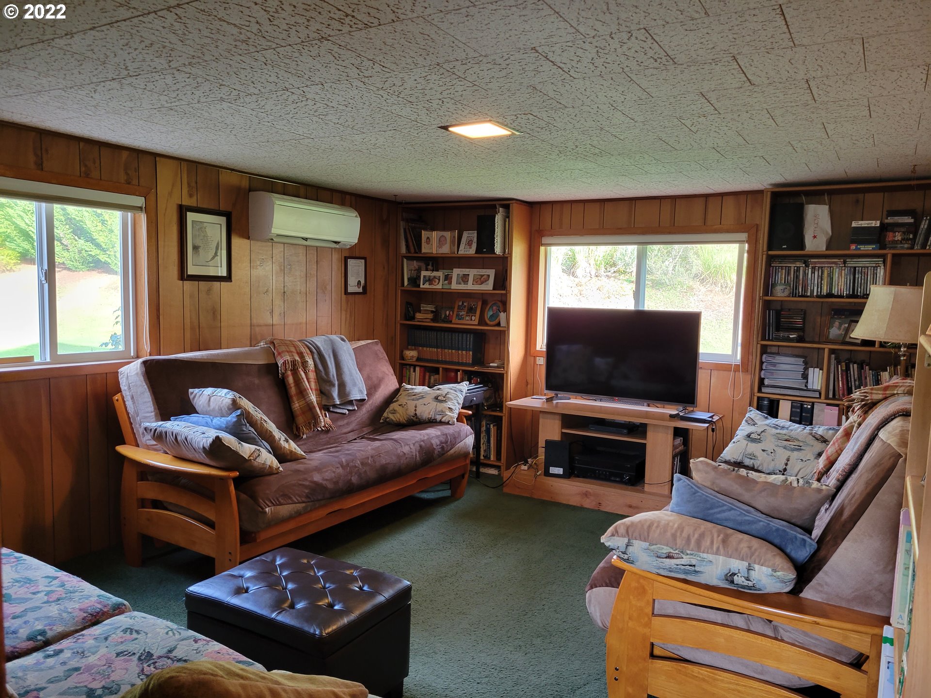 5064 Henderer Road Elkton, OR 97436 - Photo 7 of 32 a living room with furniture and a flat screen tv