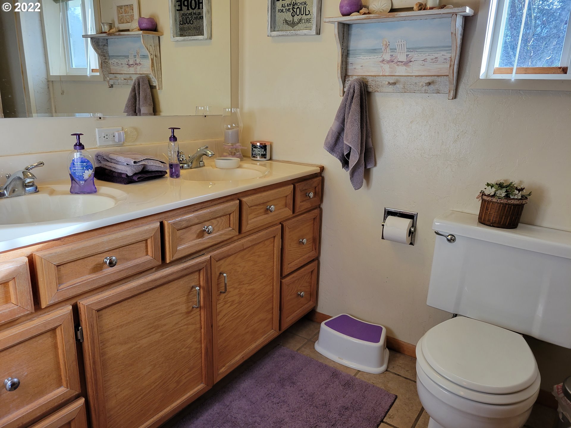 5064 Henderer Road Elkton, OR 97436 - Photo 9 of 32 a bathroom with a granite countertop toilet sink and mirror