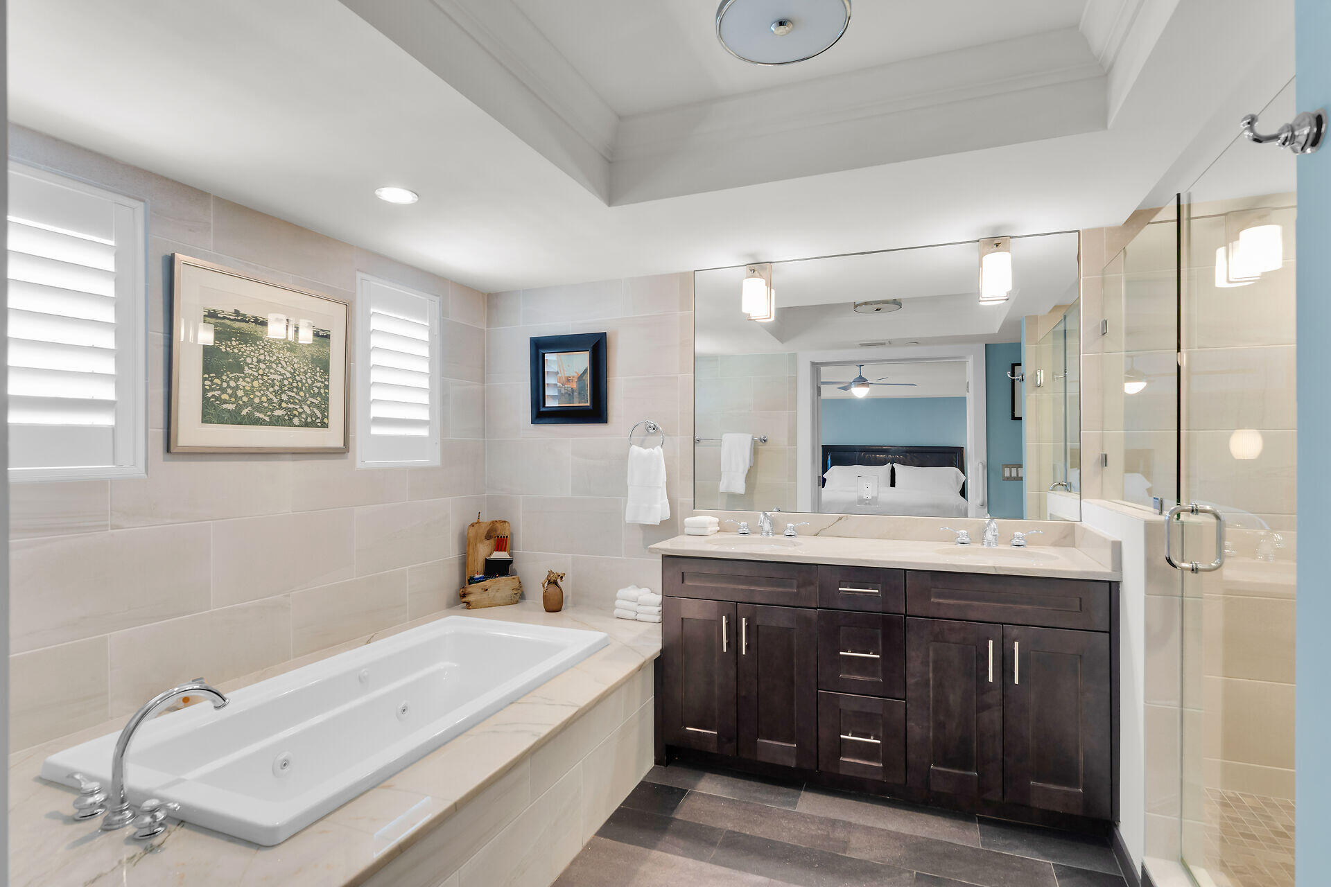 141 Simonton Street Key West, FL 33040 - Photo 28 of 49 a en suite bathroom with a granite countertop double vanity sink a mirror a bathtub and vanity