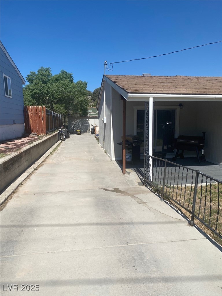 27 Carson Court Ely, NV 89301 - Photo 2 of 22 View of side of home featuring a patio area