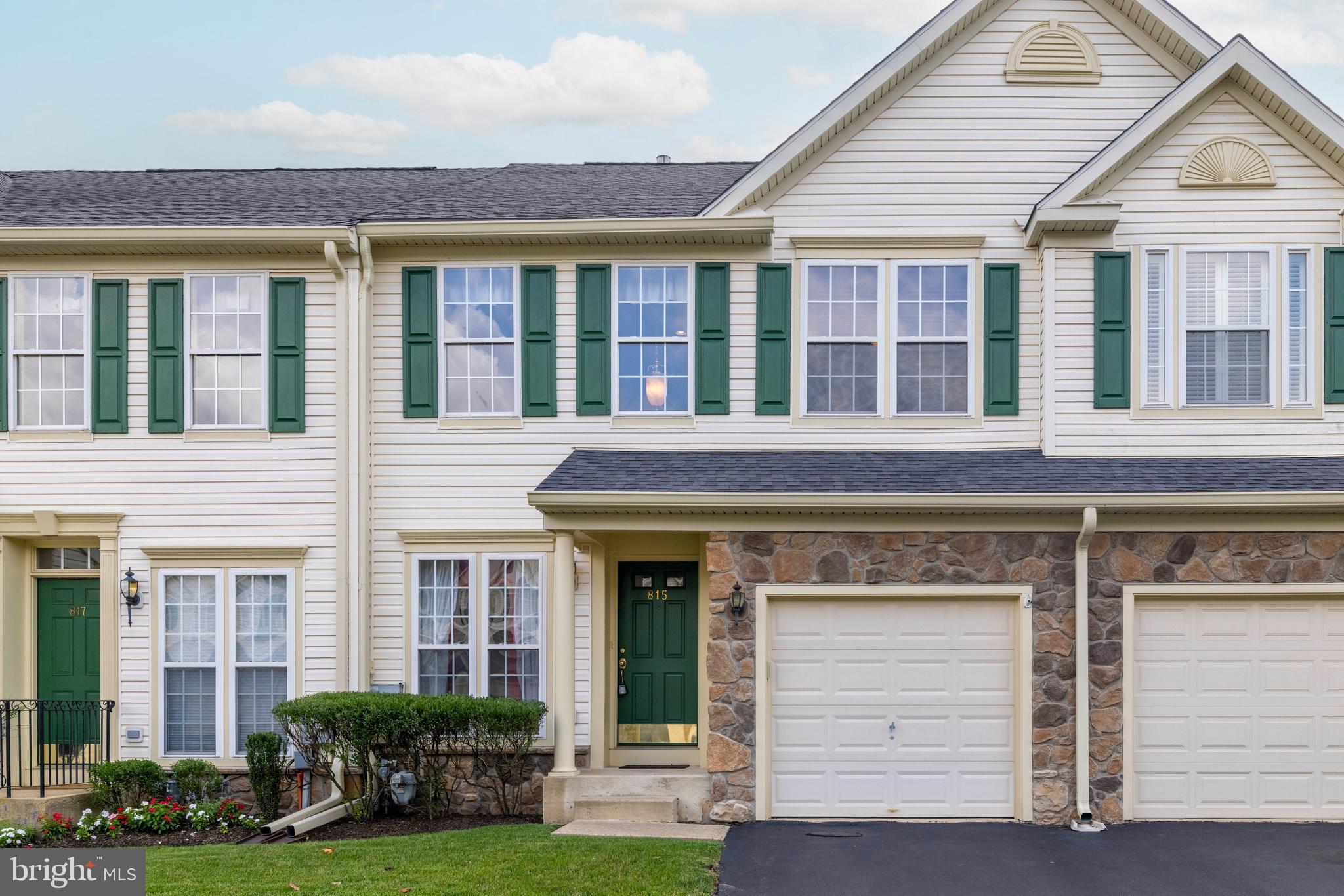 815 Geranium Drive Warrington, PA 18976 - Photo 1 of 33 a view of a white building with potted plants and a yard