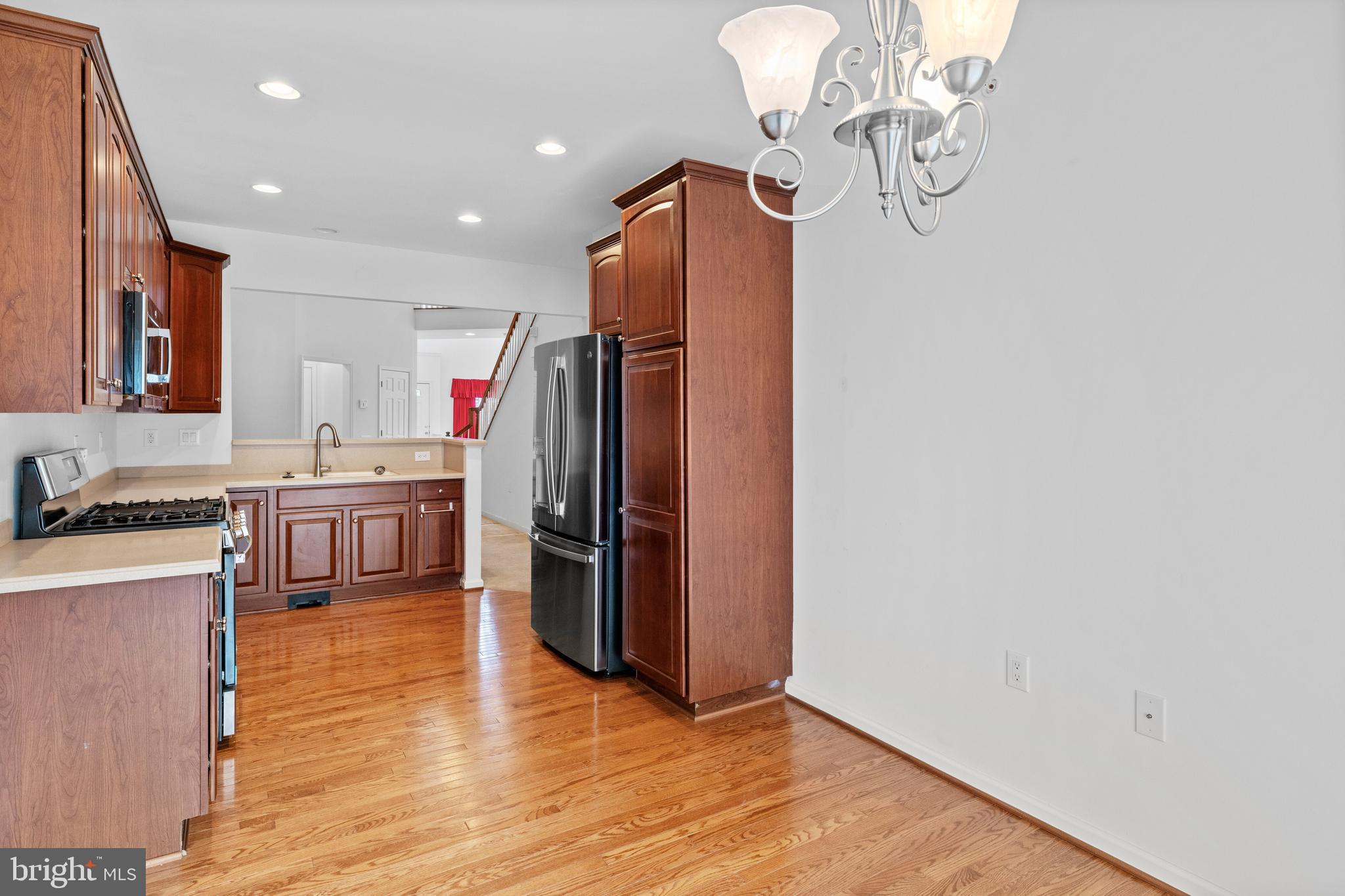 815 Geranium Drive Warrington, PA 18976 - Photo 11 of 33 a kitchen with stainless steel appliances granite countertop a refrigerator a stove a sink and a microwave