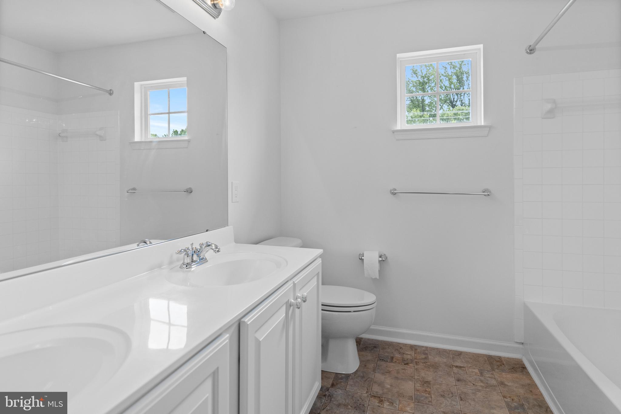 815 Geranium Drive Warrington, PA 18976 - Photo 23 of 33 a bathroom with a sink toilet and vanity