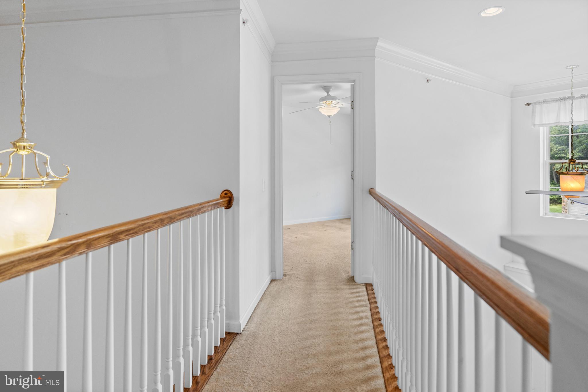 815 Geranium Drive Warrington, PA 18976 - Photo 25 of 33 a view of a hallway with wooden floor and stairs