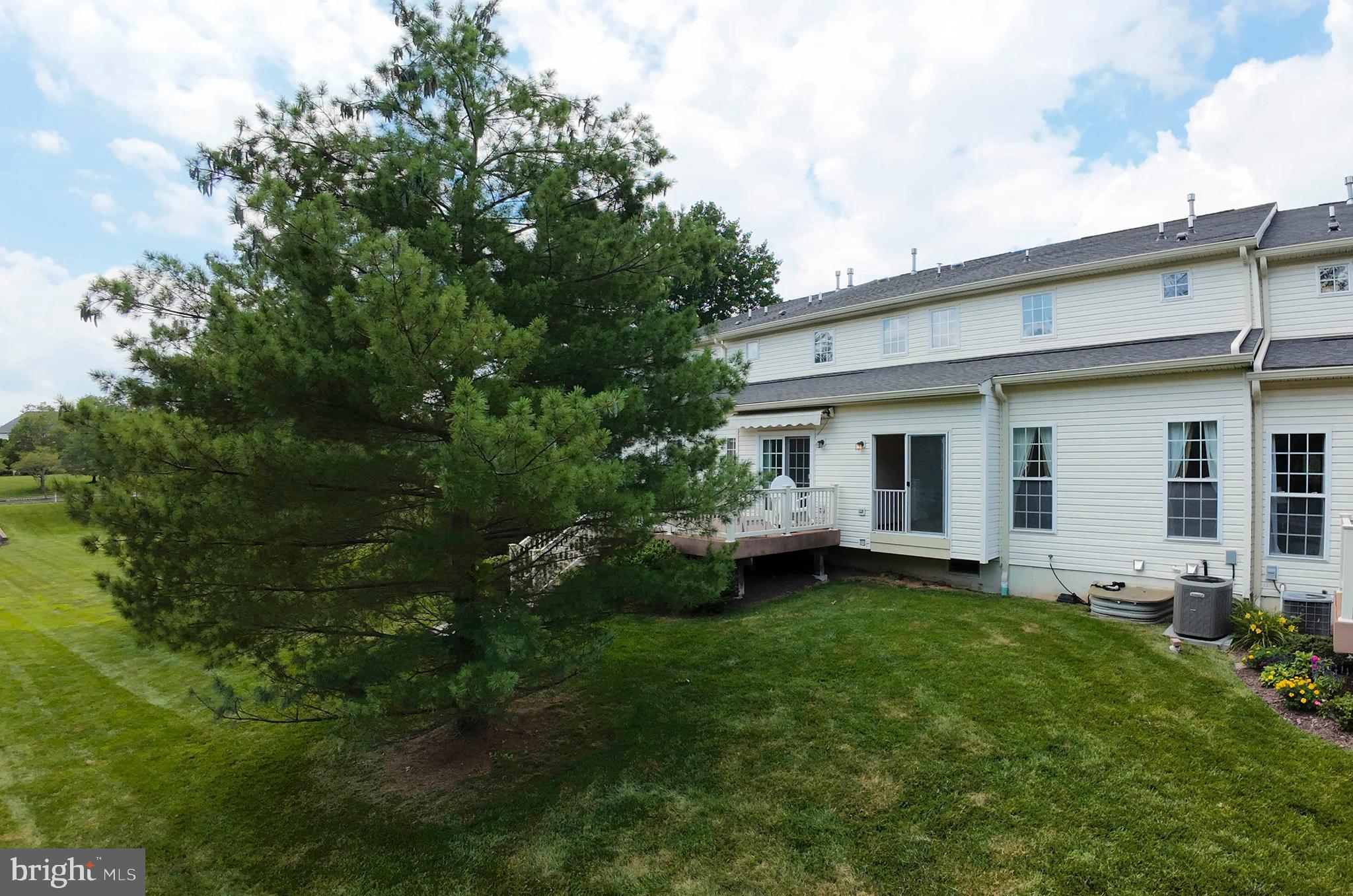 815 Geranium Drive Warrington, PA 18976 - Photo 32 of 33 a view of a house with backyard sitting area and garden