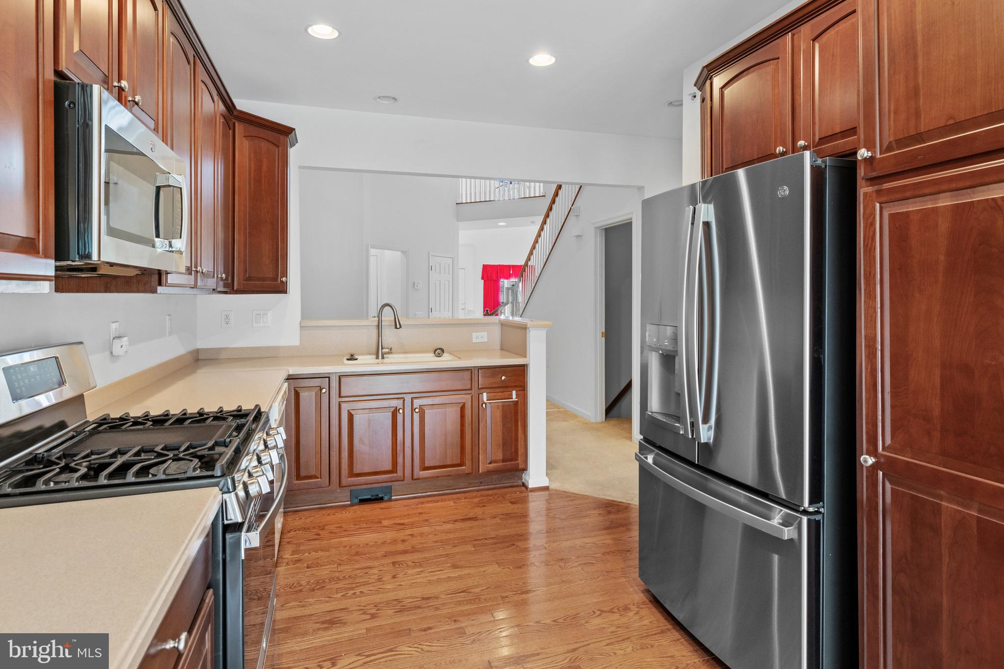 815 Geranium Drive Warrington, PA 18976 - Photo 10 of 33 a kitchen with stainless steel appliances granite countertop a refrigerator stove and sink