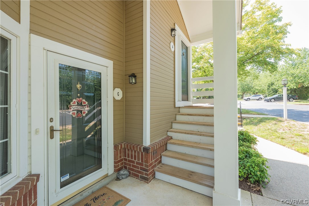 4701 Four Seasons Terrace, Unit G Glen Allen, VA 23060 - Photo 1 of 22 a view of front door and porch with wooden floor