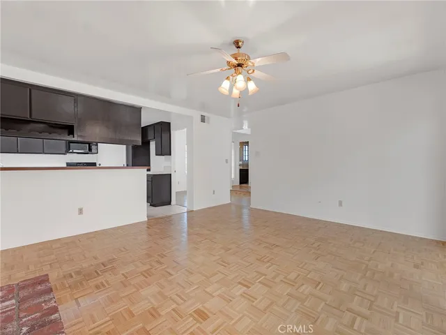 a view of a kitchen with a sink and a chandelier
