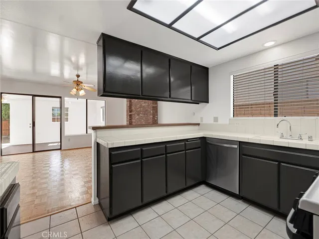 a kitchen with a sink and cabinets
