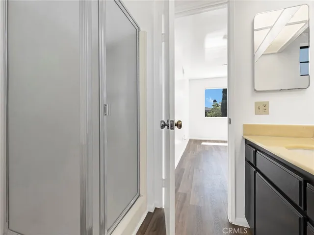 a view of a kitchen from a hallway