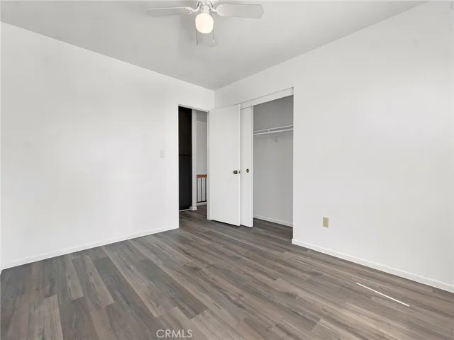 an empty room with wooden floor