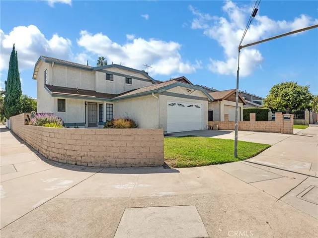 a front view of a house with garage