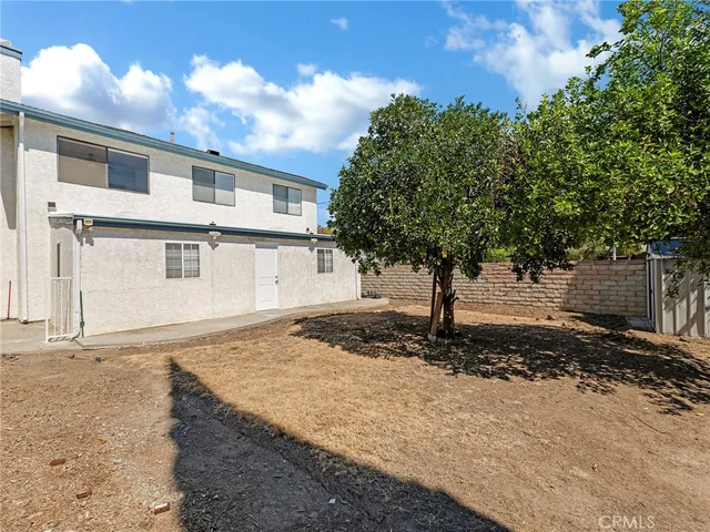 a front view of a house with trees
