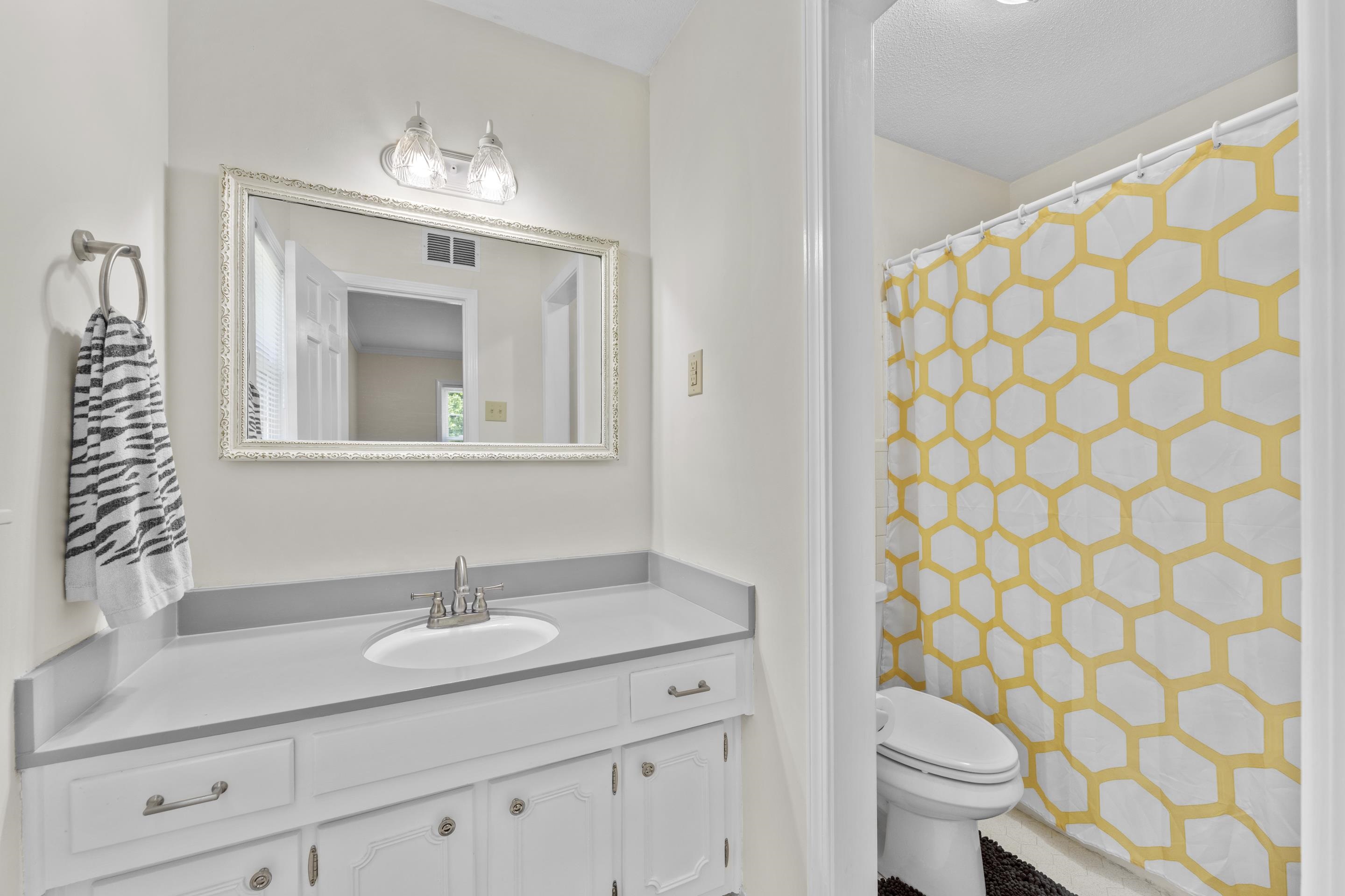 2218 Riverdale Road Germantown, TN 38138 - Photo 20 of 40 Private primary bathroom featuring a nice vanity, abundant storage, and a bright, comfortable design.