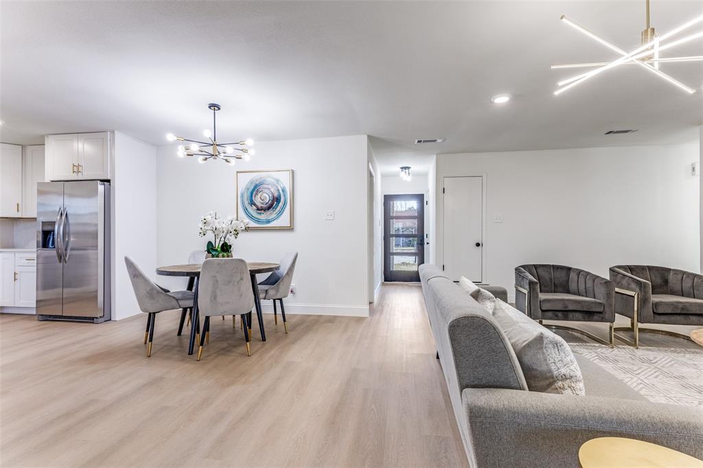 7609 Walnuthill Court Watauga, TX 76148 - Photo 6 of 22 a view of a dining room with furniture and wooden floor