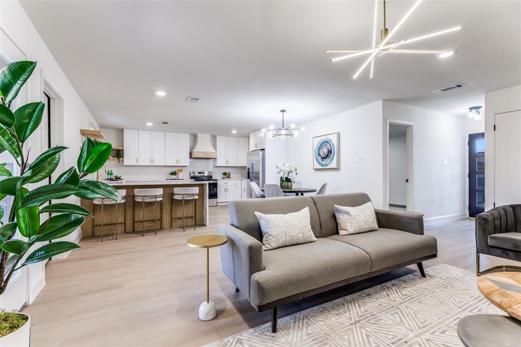 7609 Walnuthill Court Watauga, TX 76148 - Photo 8 of 22 a living room with furniture kitchen and a potted plant