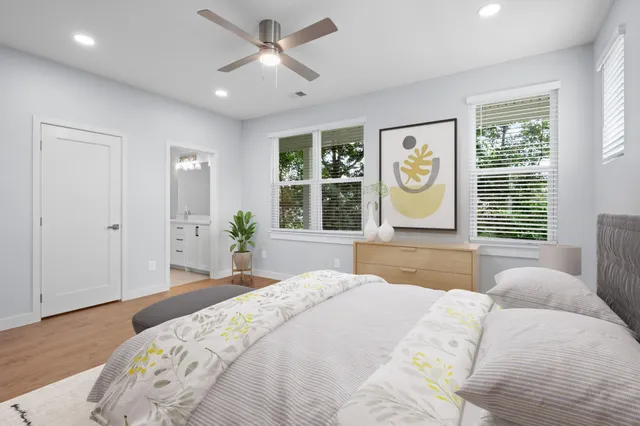 a bedroom with a large bed and a window