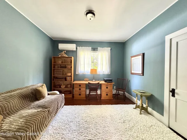 a living room with furniture or couch and a window