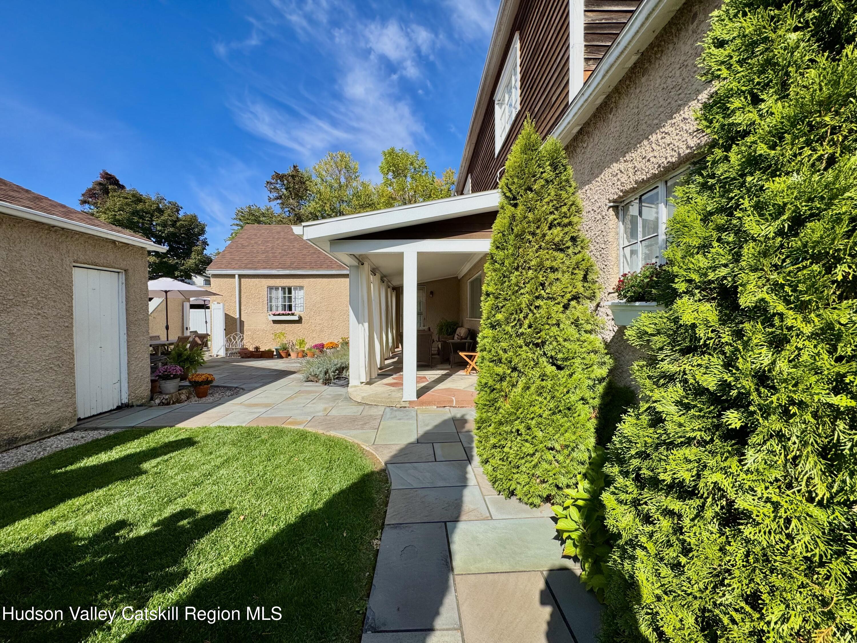 121 High Street Catskill, NY 12414 - Photo 2 of 29 a front view of a house with a yard