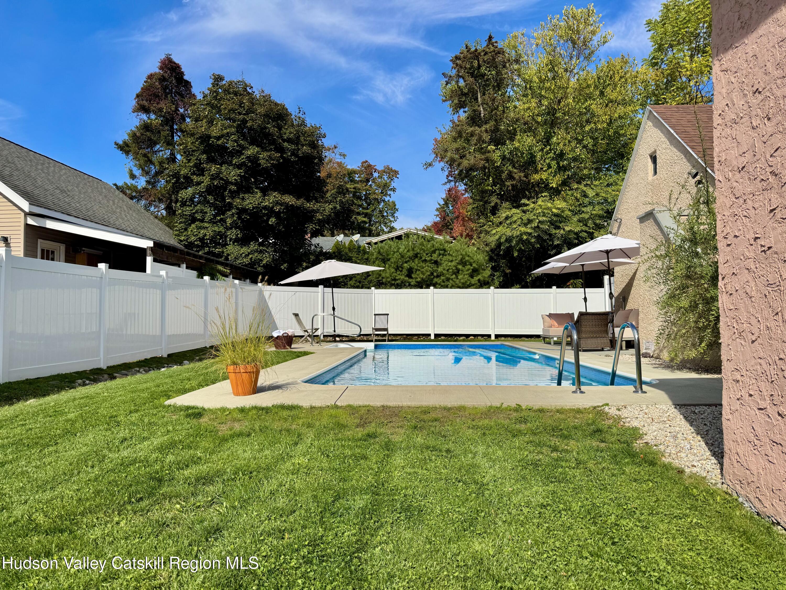 121 High Street Catskill, NY 12414 - Photo 24 of 29 a swimming pool with wooden fence