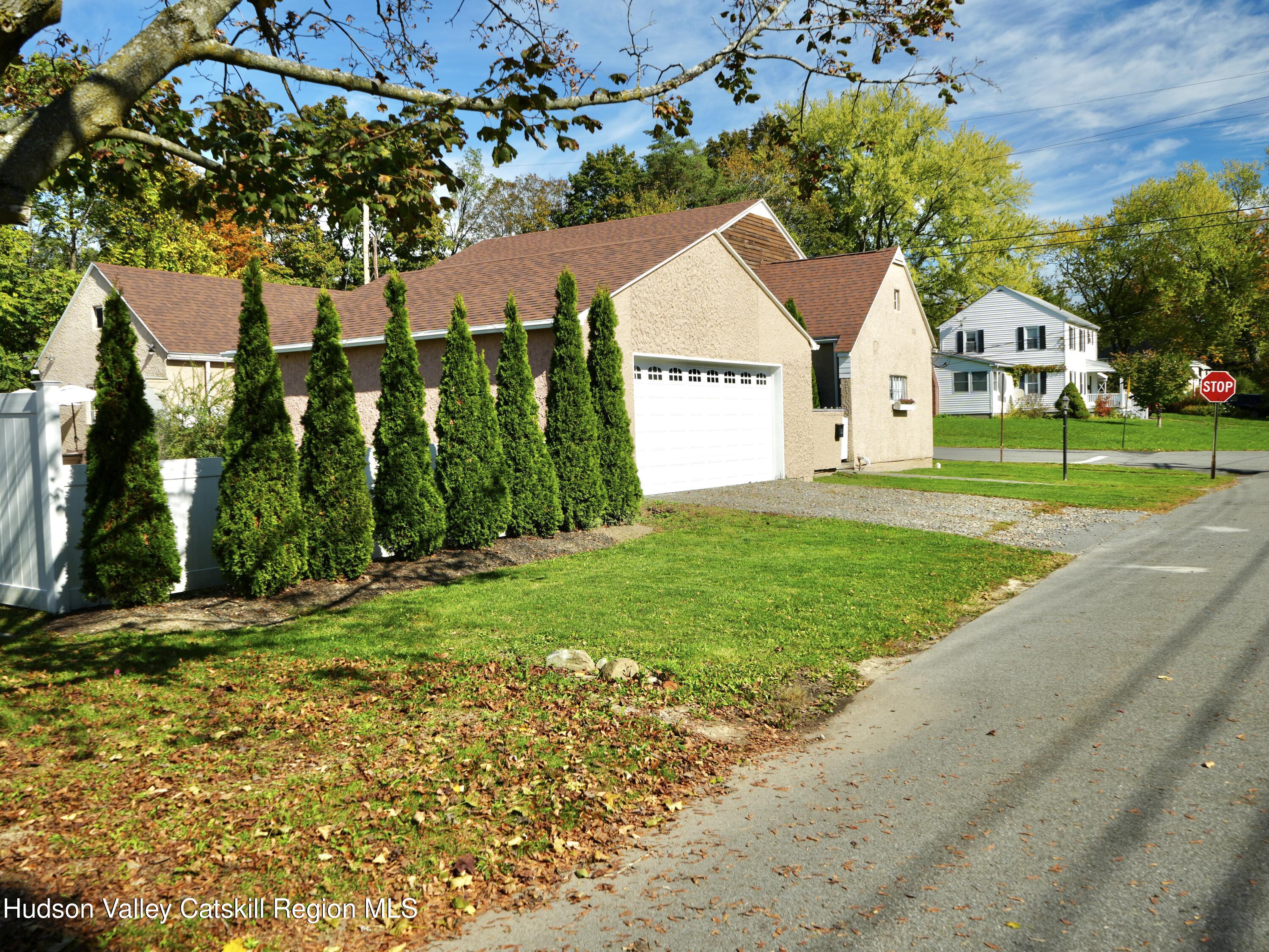 121 High Street Catskill, NY 12414 - Photo 26 of 29 a front view of a house with garden