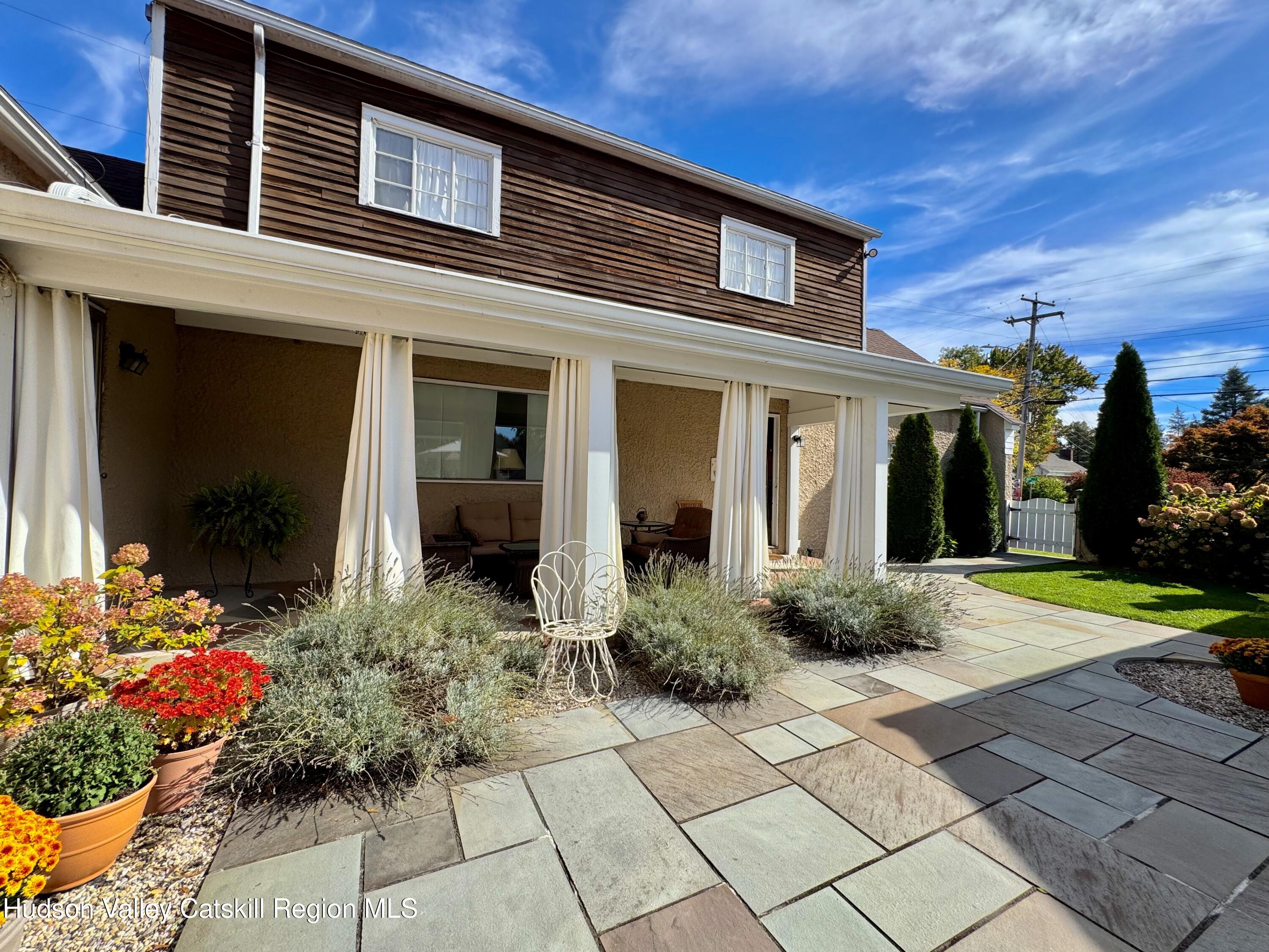 121 High Street Catskill, NY 12414 - Photo 4 of 29 a view of a house with potted plants