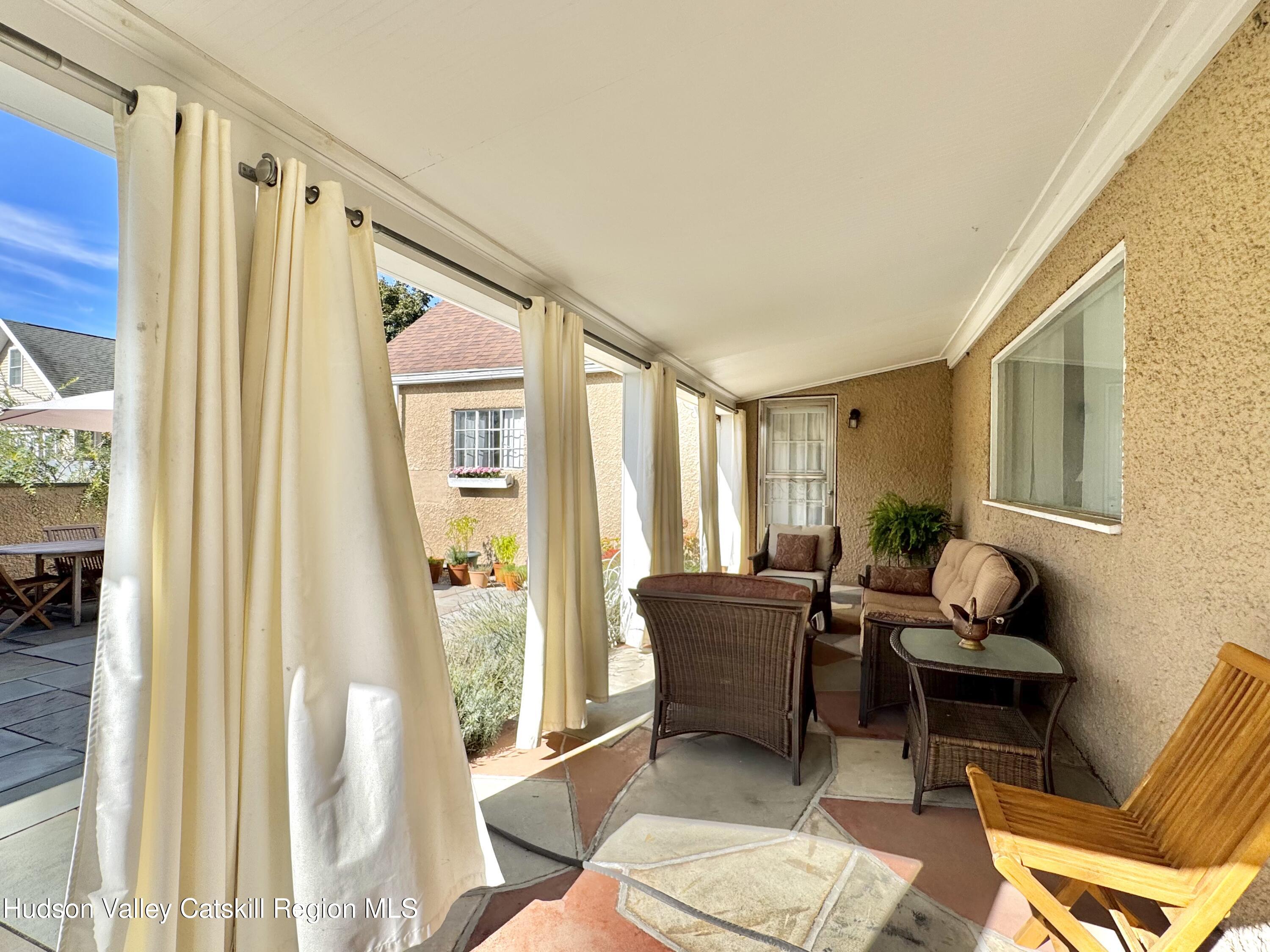 121 High Street Catskill, NY 12414 - Photo 5 of 29 a living room with furniture and a window