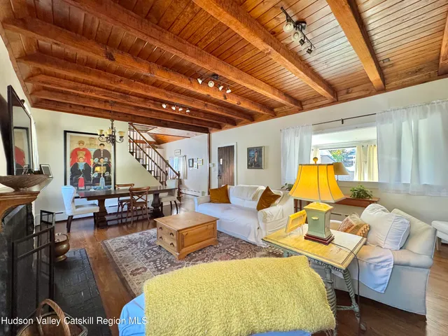 a view of a livingroom with furniture and a table