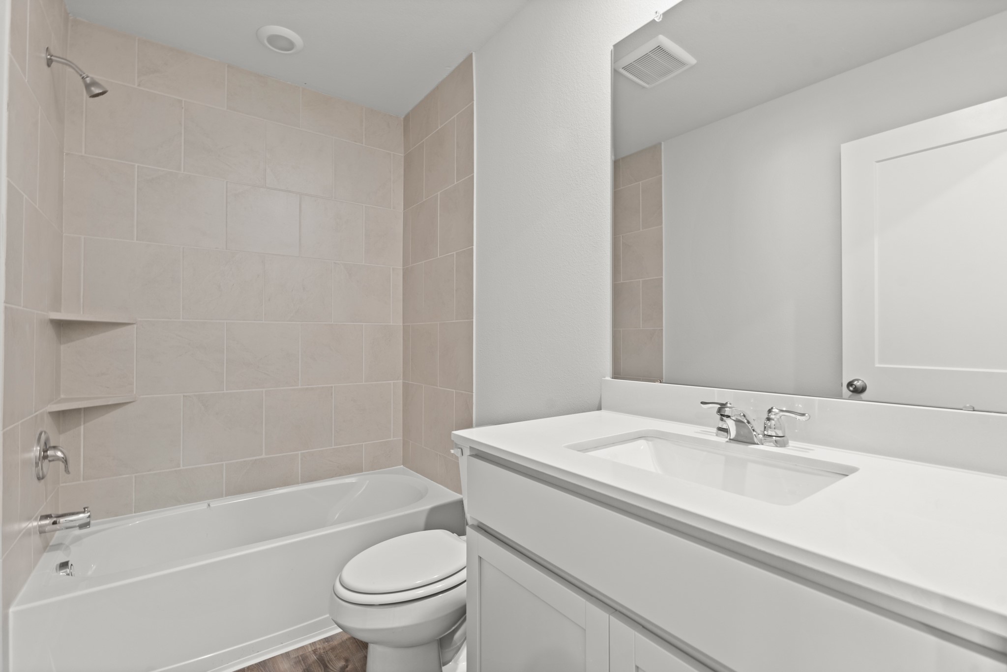 557 Wax Myrtle Way Hockley, TX 77447 - Photo 17 of 25 a bathroom with a granite countertop sink a toilet and a bathtub