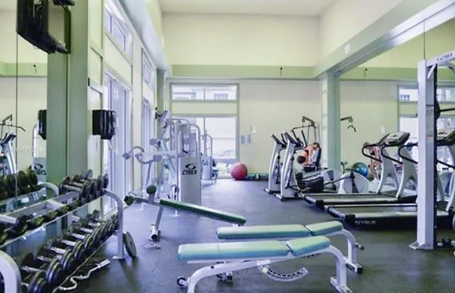 a room with lots of gym equipment