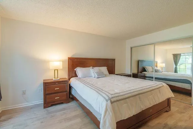 a bedroom with a bed and window