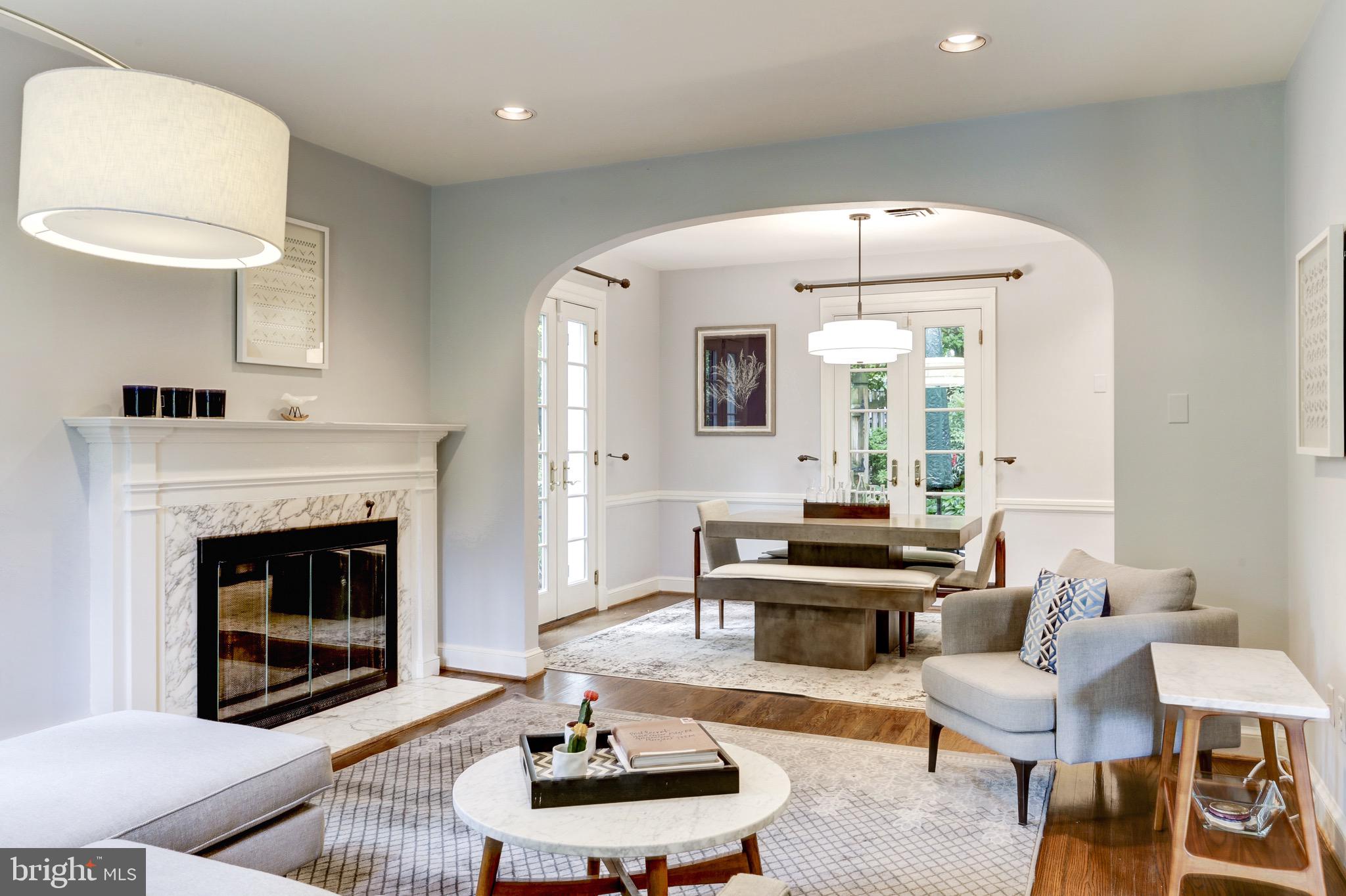 4700 Reservoir Road Northwest Washington, DC 20007 - Photo 12 of 36 a living room with furniture and a fireplace