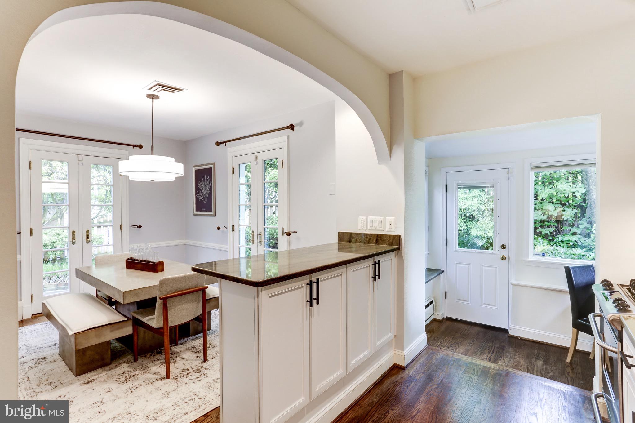 4700 Reservoir Road Northwest Washington, DC 20007 - Photo 18 of 36 a room with table chairs and wooden floor
