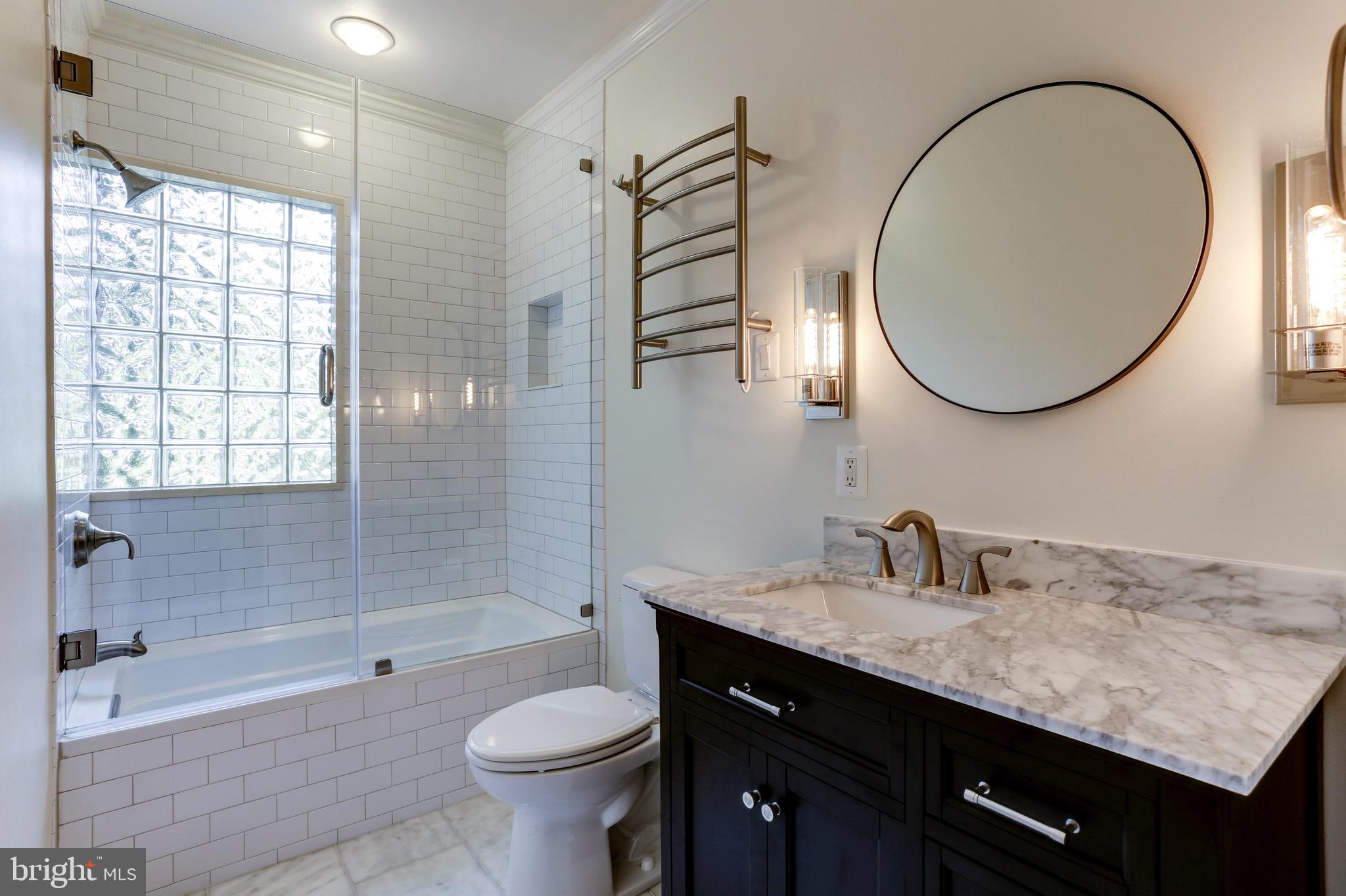 4700 Reservoir Road Northwest Washington, DC 20007 - Photo 25 of 36 a bathroom with a sink a toilet and a bathtub