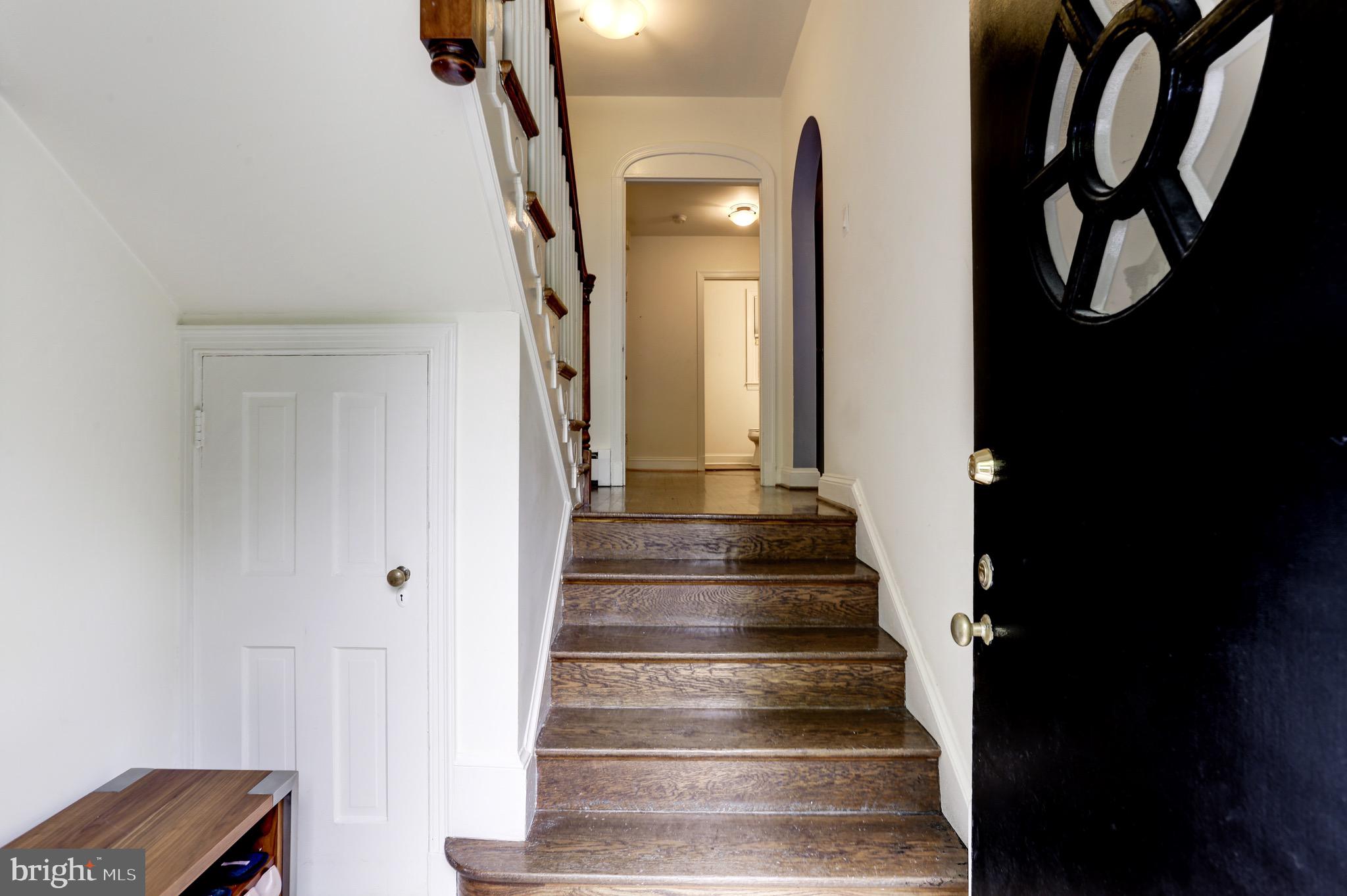 4700 Reservoir Road Northwest Washington, DC 20007 - Photo 3 of 36 a view of staircase with white walls
