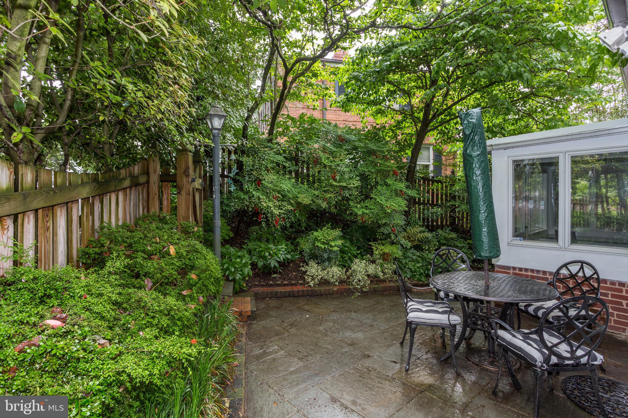 4700 Reservoir Road Northwest Washington, DC 20007 - Photo 31 of 36 a view of a backyard with sitting area