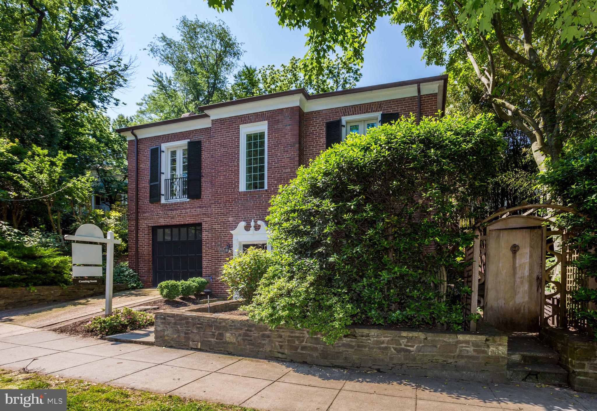 4700 Reservoir Road Northwest Washington, DC 20007 - Photo 34 of 36 a front view of house with yard and green space