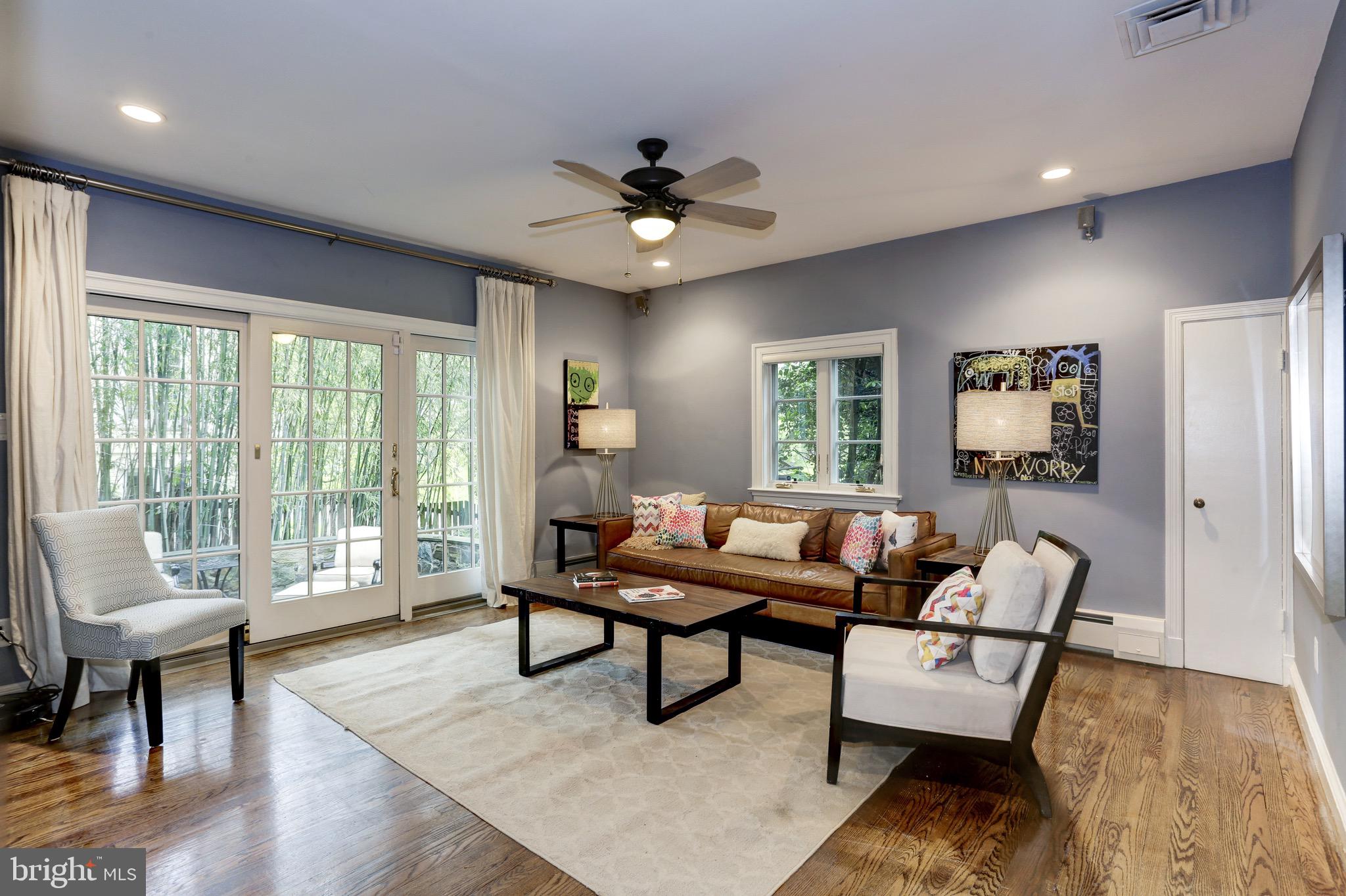 4700 Reservoir Road Northwest Washington, DC 20007 - Photo 5 of 36 a living room with furniture and wooden floor