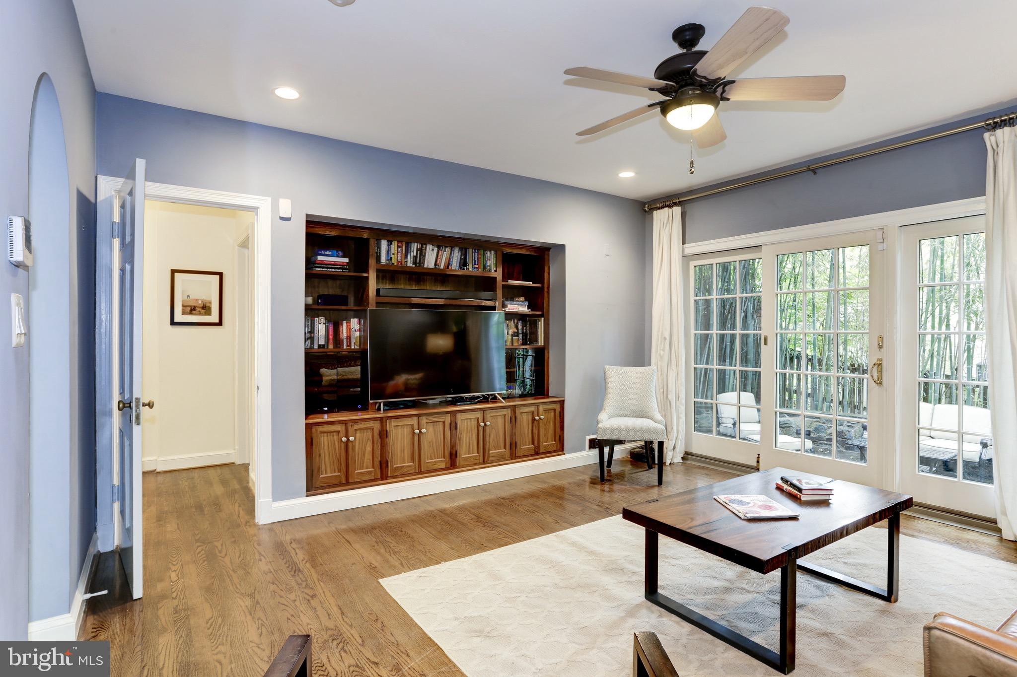 4700 Reservoir Road Northwest Washington, DC 20007 - Photo 6 of 36 a living room with furniture and a flat screen tv