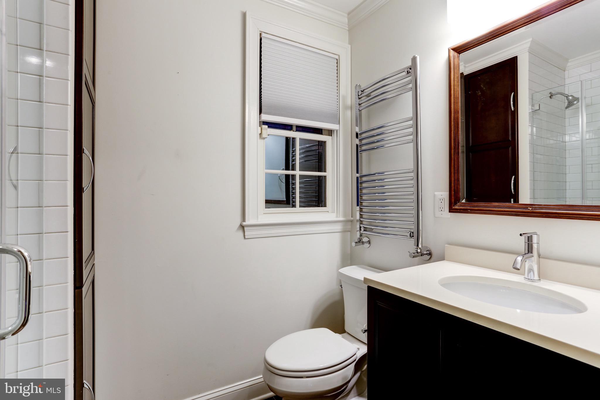 4700 Reservoir Road Northwest Washington, DC 20007 - Photo 8 of 36 a bathroom with a sink a toilet and shower