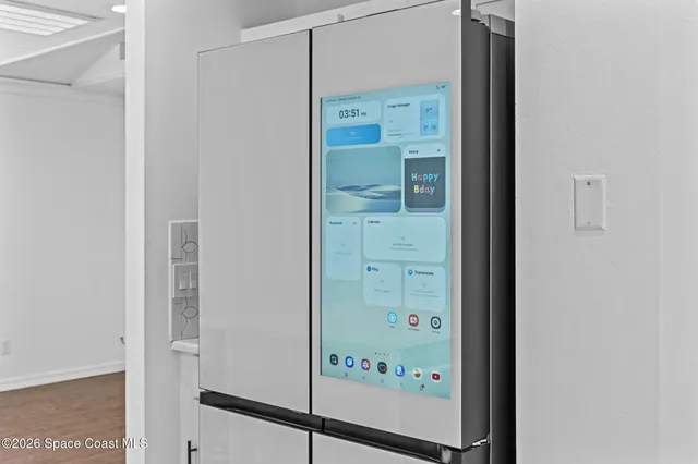 a bathroom with a glass shower door and a sink