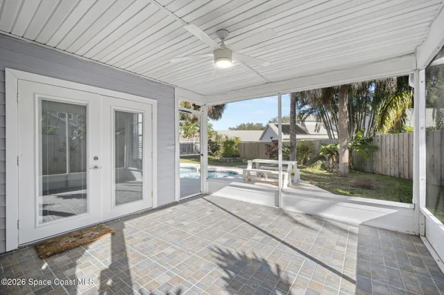 a view of a porch with a floor to ceiling window